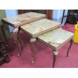 A Nest of Three Italian Style Gilt Metal Coffee Tables, with rectangle onyx tops, the largest 57cm