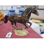 Beswick Galloping Horse, in tan, stamped 1374, to naturalistic base.