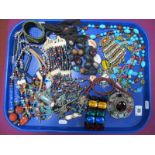 A Selection of Multi Bead Necklaces and Bracelets, a large circular Celtic style brooch, with
