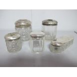 Assorted Hallmarked Silver Topped Glass Dressing Table Jars, one inscribed "Evelyn" (damages). (5)