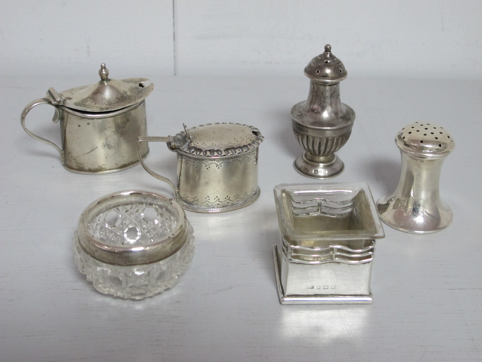 Small Hallmarked Silver Lidded Mustard Pots, with blue glass liners; two hallmarked silver