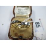 A Delicate 18ct Gold Three Stone Diamond Ring, the graduated brilliant cut stones claw set,