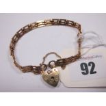 A 9ct Gold Bracelet, of uniform design, to 9ct gold heart shape padlock clasp (9grams).