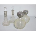 A Pair of Hallmarked Silver Tipped Globular Glass Scent Bottles, London 1904; together with a pair