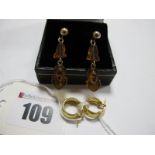 A Small Pair of Plain Creole Style Earrings, stamped "750", together with a pair of decorative amber