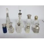 A Collection of Assorted Hallmarked Silver Topped Glass Jars, scent bottles, etc (damages). (9)