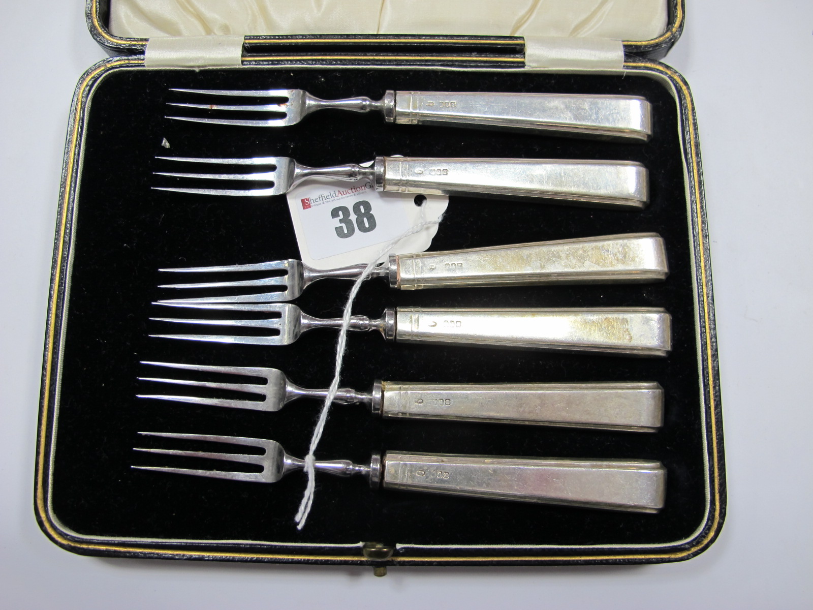 A Set of Six Irish Hallmarked Silver Handled Forks,T.W, Dublin 1941, in a case.