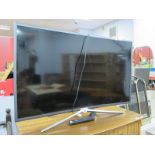 A Samsung 40" Curved TV, with remote control.