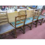 A Set of Six Oak Dining Chairs, each with wavy ladder backs, on turned and block supports.