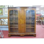 A Walnut Display Cabinet, with twin astragal doors flanking central panel 105cm wide.