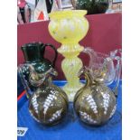 A Pair of Late XIX Century Glass Jugs, with clear glass handles and lily of the valley decoration (