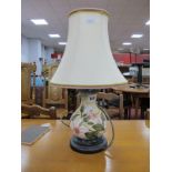 A Moorcroft Pottery Table Lamp, painted with s design of pink flowers, 16.5cm high,on wooden base