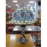 Tiffany Style Table Lamp, with bell shade and gilt lower body, approximately 64cm high.
