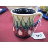 A Moorcroft Pottery Mug, painted in the 'April Tulip' design by Emma Bossons, impressed and