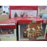 A Large Porcelain Christmas Figure Group, Village Collection lighted house and inn and a stagecoach,