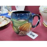 A Moorcroft Pottery Mug, painted in the 'Anna Lily' design by Nicola Slaney, impressed and painted