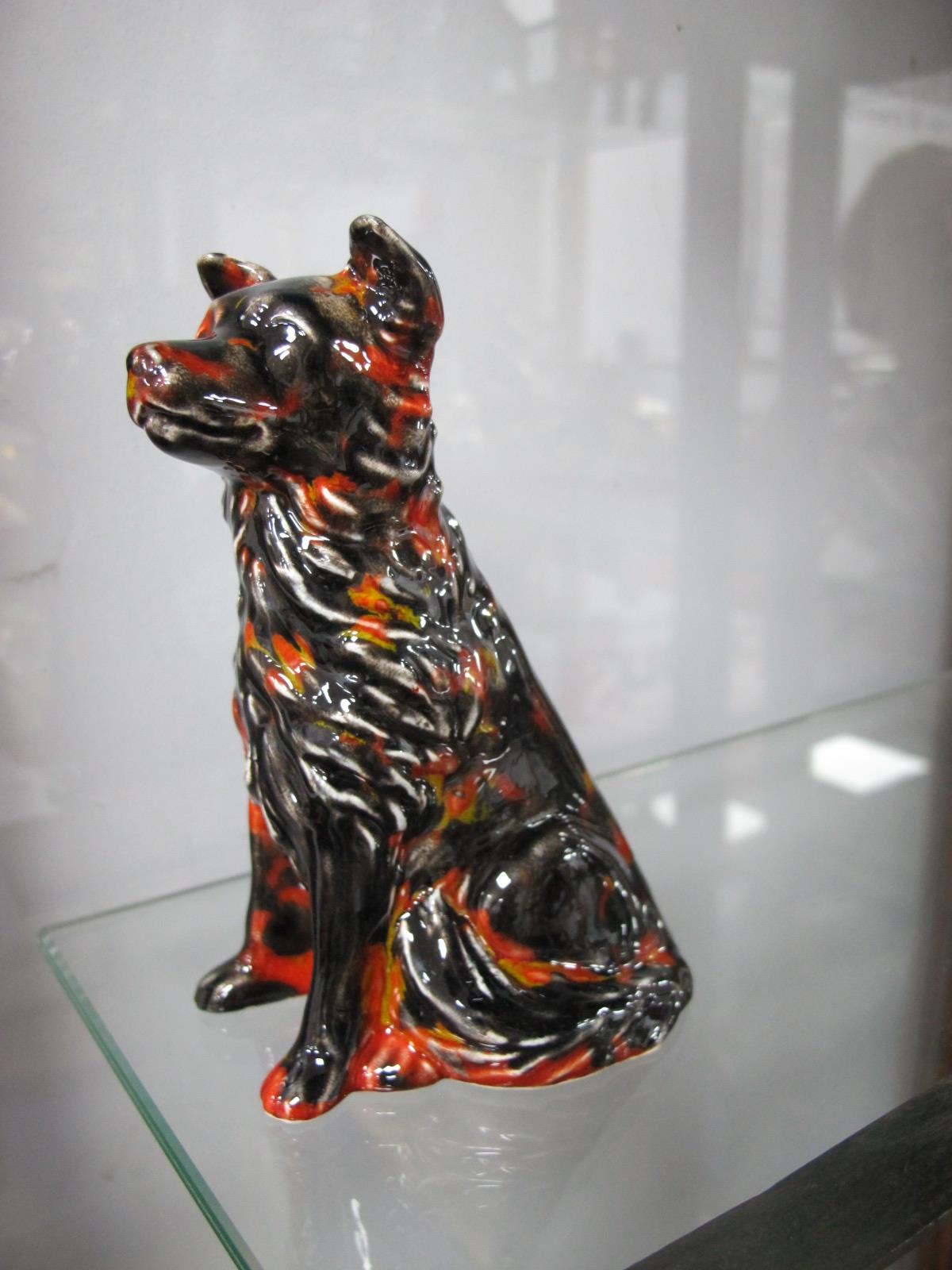 An Anita Harris Model of a Collie Dog, gold signed, 14cm high.