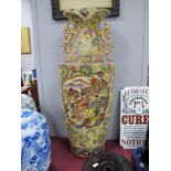 A Chinese Style Twin Handled vase, with floral decoration, on a stand.