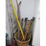Garden Tools, rakes, fork, spade, a half round whisky barrel with black bands, step ladders.