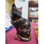 An Anita Harris Model of a Sitting Cat (looking left with mystic blue eyes), 8¼" high, gold