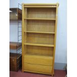 A Light Wood Open Shelf Unit, with twin drawers below, 95cm wide.