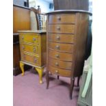 Yew Wood Small Chest of Three Drawers on cabriole legs, 43cm wide, an oval chest of seven drawers,