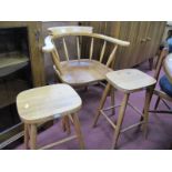 A Captain's Chair, in the Ercol manner, two stools. (3)