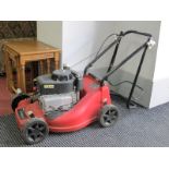 A Sovereign Petrol Lawn Mower.