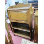 Oak Bureau, circa 1920's, with wavy gallery, fall front over two shelves, 69.5cm wide.