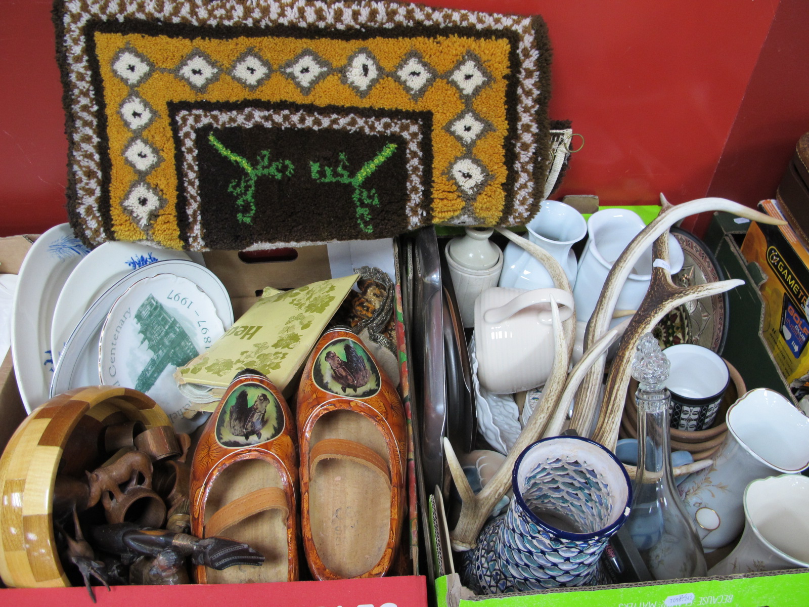 Pottery, stainless steel dishes, Dutch clogs, carved figures, rug, antlers, etc:- Two Boxes