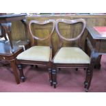 A Set of Three XIX Century Mahogany Balloon Back Chairs, with drop in seats turned legs; together
