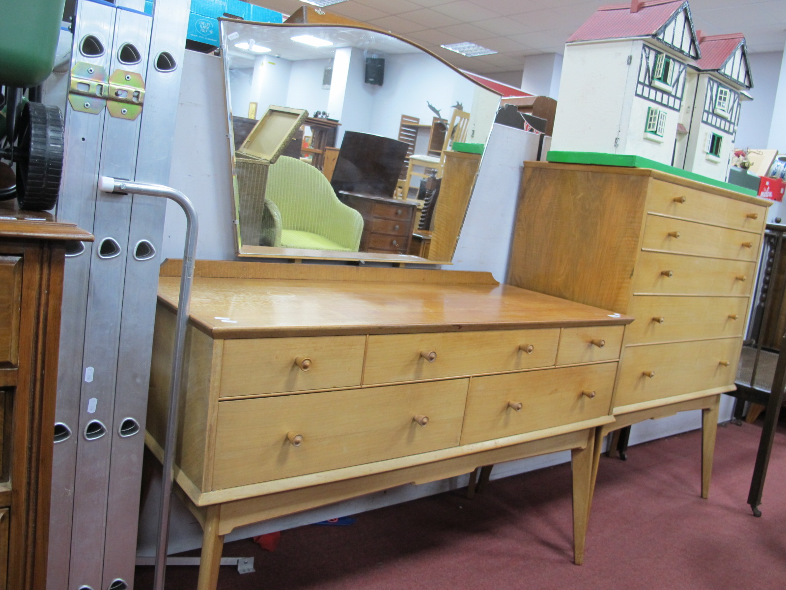 A 1960's Walnut Dressing Table,with three top drawers over two short drawers on splayed legs, with