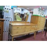 A 1960's Walnut Dressing Table,with three top drawers over two short drawers on splayed legs, with