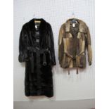 A Dark Brown Mink Coat, with leather panels, fitted waist with belt, mid calf length (130cm) and a