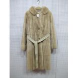 A Pale Cream Full Length Mink Coat, slightly fitted style with buttoned split cuff detail and