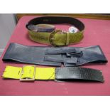 An Amanda Wakeley Navy Blue Leather Obi Style Belt, Yves St Laurent yellow and black leather panel