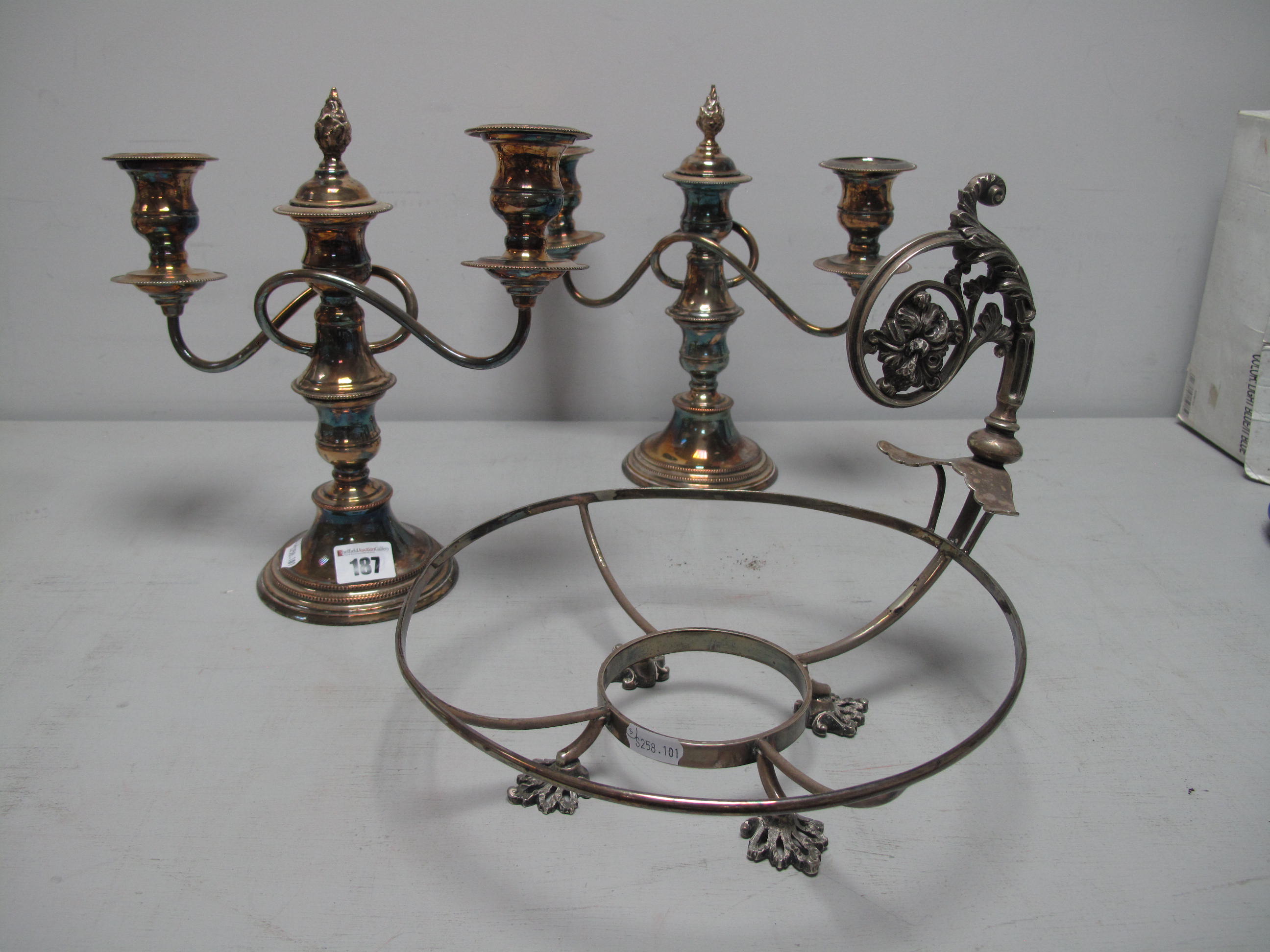 A Pair of Plated Twin Branch Candelabra, (three light converting to a pair of dwarf candlesticks);
