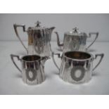An Electroplated Four Piece Tea Set, each of fluted tapering oval form, with vacant oval