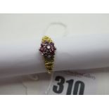 An 18ct Gold Cluster Dress Ring, of flowerhead design, claw set throughout between wide openwork