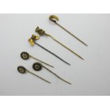 A Seated Gargoyle Style Stick Pin, stamped "15", a horseshoe style stick pin, stamped "15ct", a