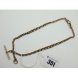 A Graduated Curb Link Chain, stamped "9.375", suspending T-bar style pendant, also stamped "9.