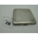 A Part Hallmarked Silver Cigarette Case, of square form allover engine turned (dented).