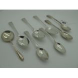 A Pair of Hallmarked Silver Teaspoons, initialled; together with a small pair of hallmarked silver