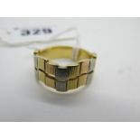 An 18ct Three Colour Gold Dress Ring, of textured modernist design, (finger size O½) (8g).