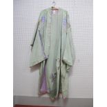 A c.1920's/30's Japanese Kimono, in pale green, embroidered with branches of mauve flowering