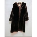 A Mid XX Century Vintage Dark Brown Beaver Lamb Full Length Coat, with wide collar and turn back