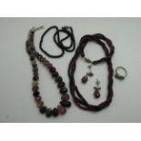 A Multi Stone Set Necklace, of graduated claw set design, with matching ring and drop earrings,