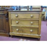 A XIX Century Pine Fronted Chest of Three Drawers, having turned handles and feet, 88cm wide.