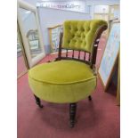 An Early XX Century Walnut Nursing Chair, with button back upholstered panel and seat, rail