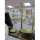 Parnall of Bristol Brass Scales, to weigh 4lb, on mahogany plinth, plus weights, 61cm wide.